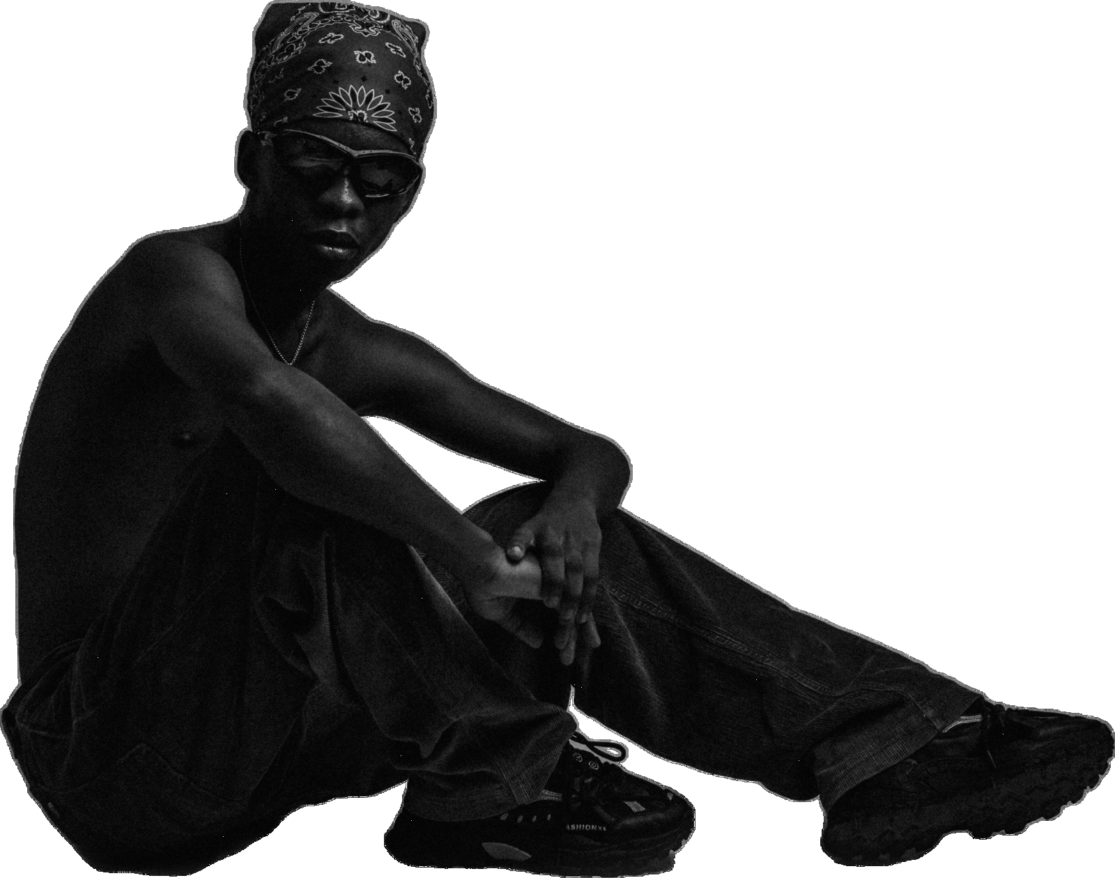 Portrait of Muyii seated, wearing a bandana and sunglasses